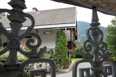 a wrought iron fence in front of a building at Turistična Kmetija Gartner 3a in Bohinj