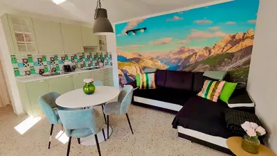 a living room with a couch and a table at Soča Home Bovec in Bovec