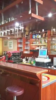 a bar in a restaurant with a laptop on a counter at Bed and Breakfast Kreft in Ljutomer