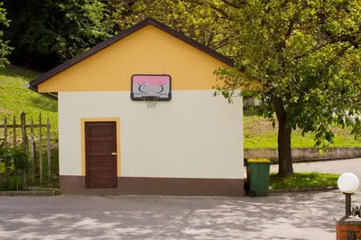 a small building with a basketball hoop on it at Tourist farm Mraz in Podčetrtek