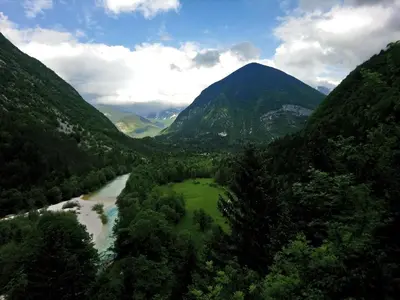 a view of a valley with a river and mountains at Apartment Joži in Soča