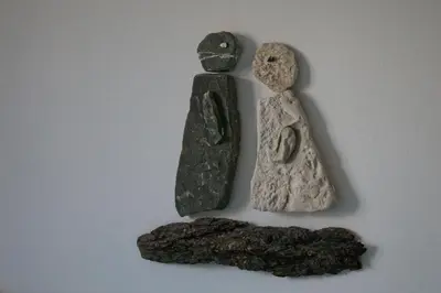 two pieces of rocks sitting on a white table at Apartma Javoršček in Bovec