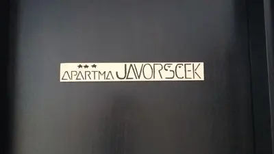 a sign on a door that readsarma universeseek at Apartma Javoršček in Bovec
