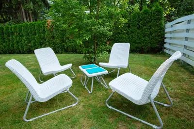 a group of three chairs and a table at Apartments Patricia in Bled