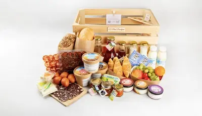 a box filled with different types of bread and food at Apartments Patricia in Bled