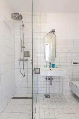 a bathroom with a shower and a sink and a mirror at Charming Terrace Apartments Ana and Maria Tour As Ljubljana in Ljubljana