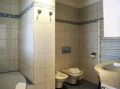 a bathroom with a toilet and a sink at Charming Terrace Apartments Ana and Maria Tour As Ljubljana in Ljubljana