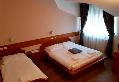 a bedroom with a bed and a window at Gostišče Jazbec - Idrsko - Kobarid in Kobarid