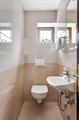 a bathroom with a toilet and a sink at Apartments Svetina in Bled
