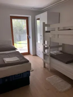 a bedroom with two bunk beds and a window at Katarina in Bled