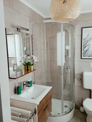a bathroom with a shower and a sink at ABC apartments in Kamnik