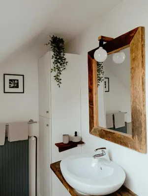 a bathroom with a sink and a mirror at ABC apartments in Kamnik