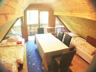 a room with a table and chairs in a house at Blazic I in Maribor