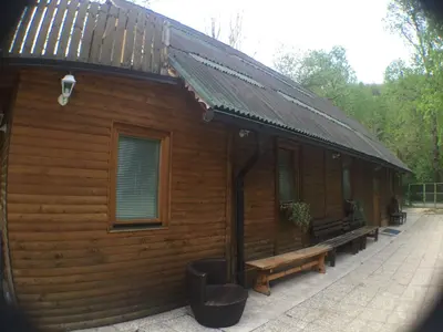 a wooden cabin with a bench in front of it at Blazic I in Maribor