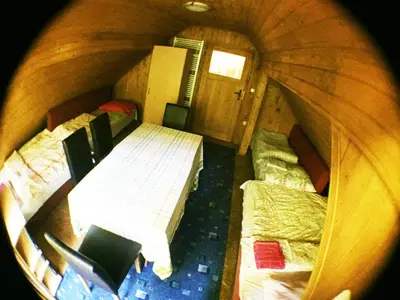 an overhead view of a room with two beds and chairs at Blazic I in Maribor