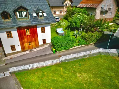 an aerial view of a house with a red door at Jacobs Resort House Planica in Kranjska Gora
