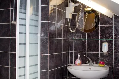 a bathroom with a sink and a mirror at Guest house Bohorč in Šentjur