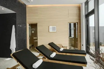 a row of lounge chairs in a room at Mond, Resort & Entertainment in Šentilj