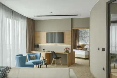 a living room with a couch and a chair at Mond, Resort & Entertainment in Šentilj