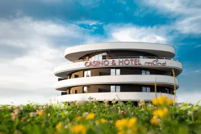 a building with a sign that reads casina and hotel indo at Mond, Resort & Entertainment in Šentilj