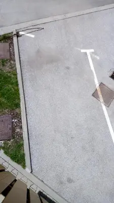 an empty street with a cross painted on the road at Apartment Katarina Kranjska Gora in Kranjska Gora