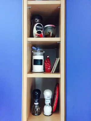a cupboard with a shelf with items on it at Simpli Apartments in Ljubljana