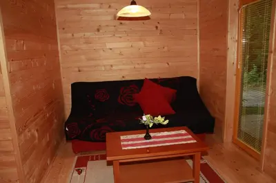 a small room with a couch and a table at Holiday House Jas-Mar in Radoslavci