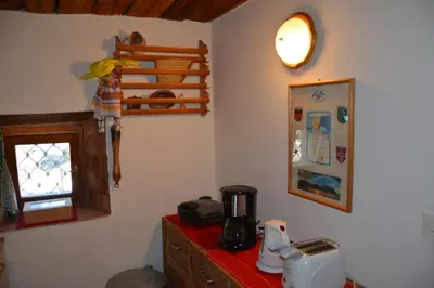 a kitchen with a red counter top and a window at Apartment Zatrnik in Bled