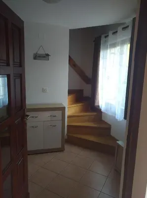 a room with a staircase and a door with a window at Apartment Sela in Tolmin