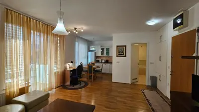 a living room with a couch and a table at Central Apartment Anita Tour As Ljubljana in Ljubljana