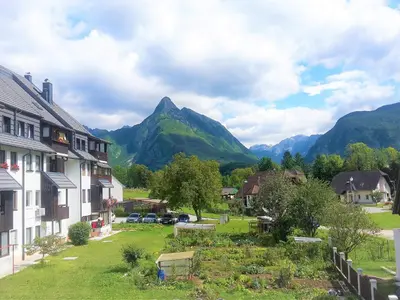 a view of a village with mountains in the background at Bovec Holiday House in Bovec