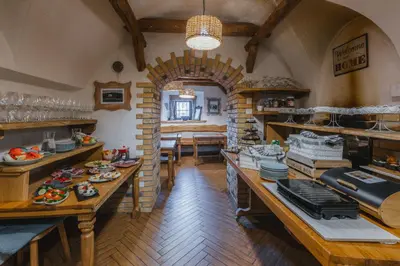 a kitchen with wooden floors and an archway in a room at Old Bled House in Bled