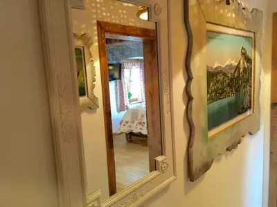 a mirror hanging on a wall in a room at Old Bled House in Bled