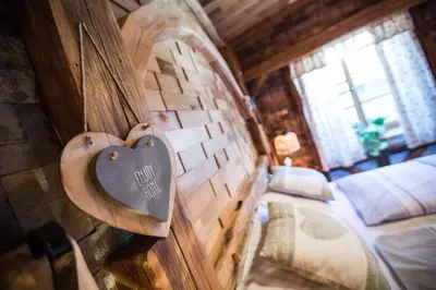 a heart hanging on a wall in a bedroom at Old Bled House in Bled