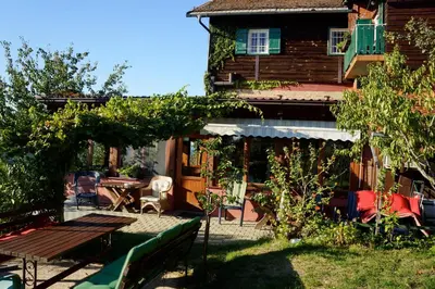 a yard with a table and a house at Agroturism Jures in Ljutomer