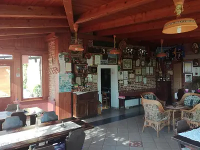 a room with a table and chairs in a building at Agroturism Jures in Ljutomer
