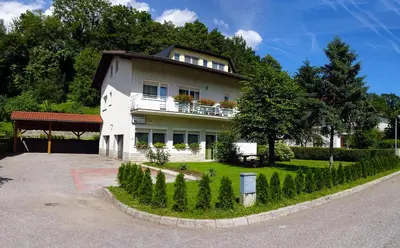 a house with a lot of plants in front of it at Apartment Kanalec in Tolmin