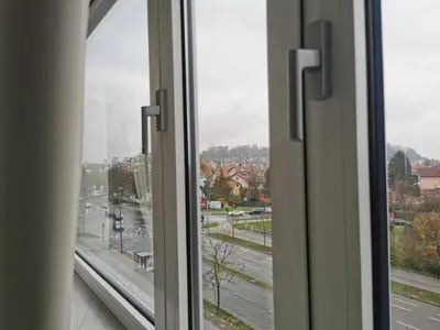 an open window with a view of a city street at Trnovo apartment with free parking in Ljubljana