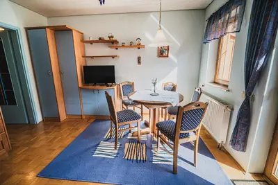 a dining room with a table and chairs at Homestay Kocka in Zgornje Jezersko