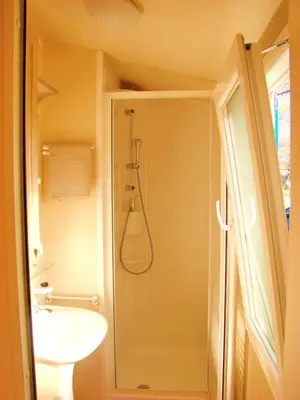 a bathroom with a shower and a sink at Mobilehouse & Camping Lijak in Šempas