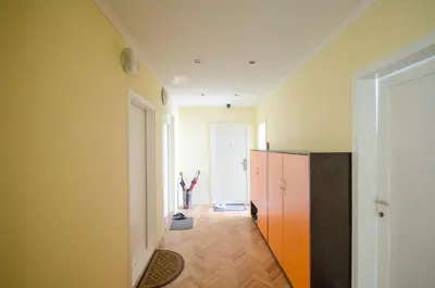 a room with a hallway with a door and a hallway at Apartment Tržaška with free parking in Ljubljana