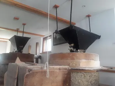 a room with three large metal drums in a building at Old Mill House in Bohinj