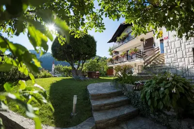 a house with stairs leading to a yard at Hisa Taljat in Most na Soči