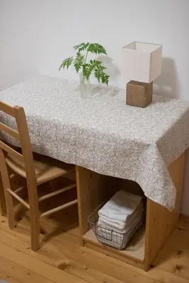 a table with a potted plant sitting on top of it at Brunarica in Bohinj