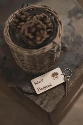 a small keychain next to a basket of food at Brunarica in Bohinj