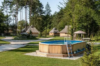 a hot tub in the middle of a yard at Slovenia Eco resort in Stahovica