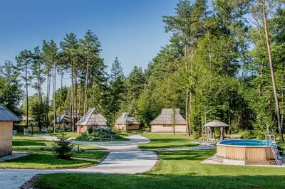 a resort with a swimming pool and a playground at Slovenia Eco resort in Stahovica