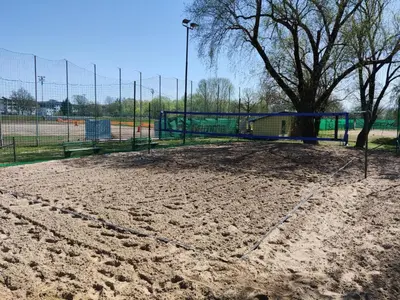 a park with a volleyball court and a playground at Sport Hotel Ljubljana in Ljubljana