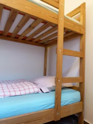 a bunk bedded room with a bunk bed in a house at Soča House Tolmin in Tolmin
