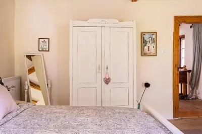 a bedroom with a bed and a white door at Holiday Home Katric in Kamno